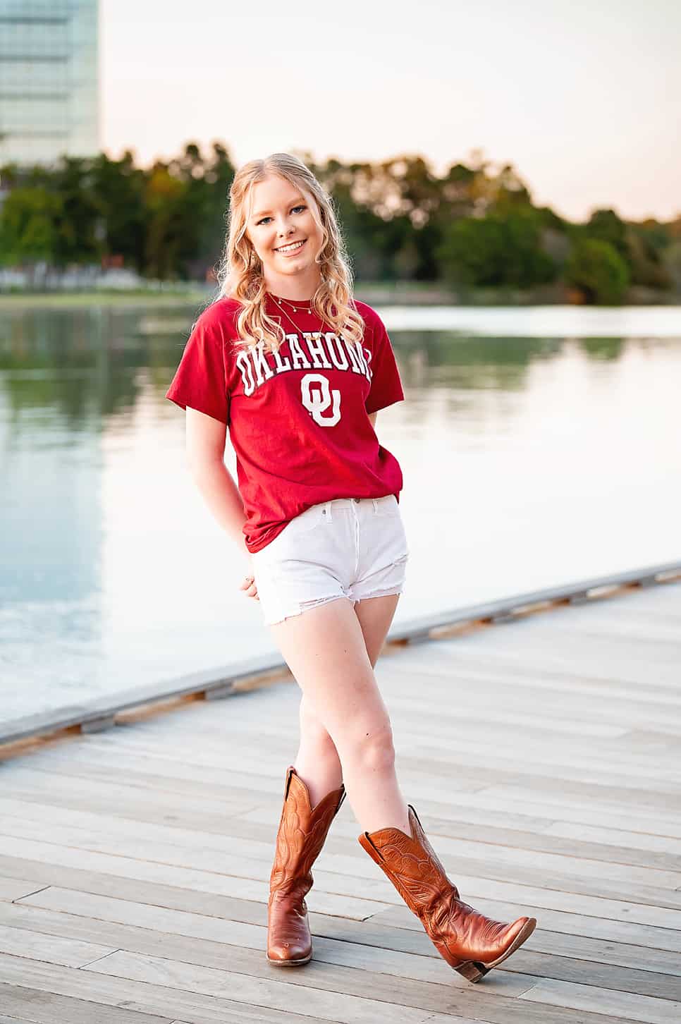 Senior girl on the water in texas at golden light