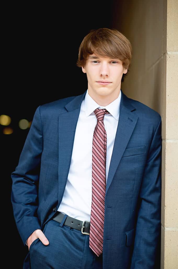 what to wear for your senior session in Houston, TX. Senior guy wearing a suit