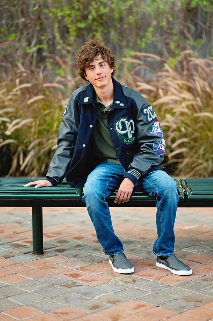 senior guy wearing a letterman jacket.