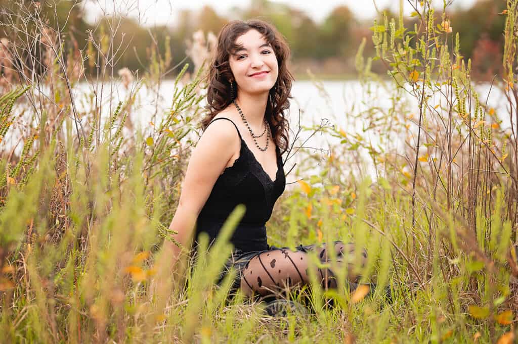 black dress girl in a field.