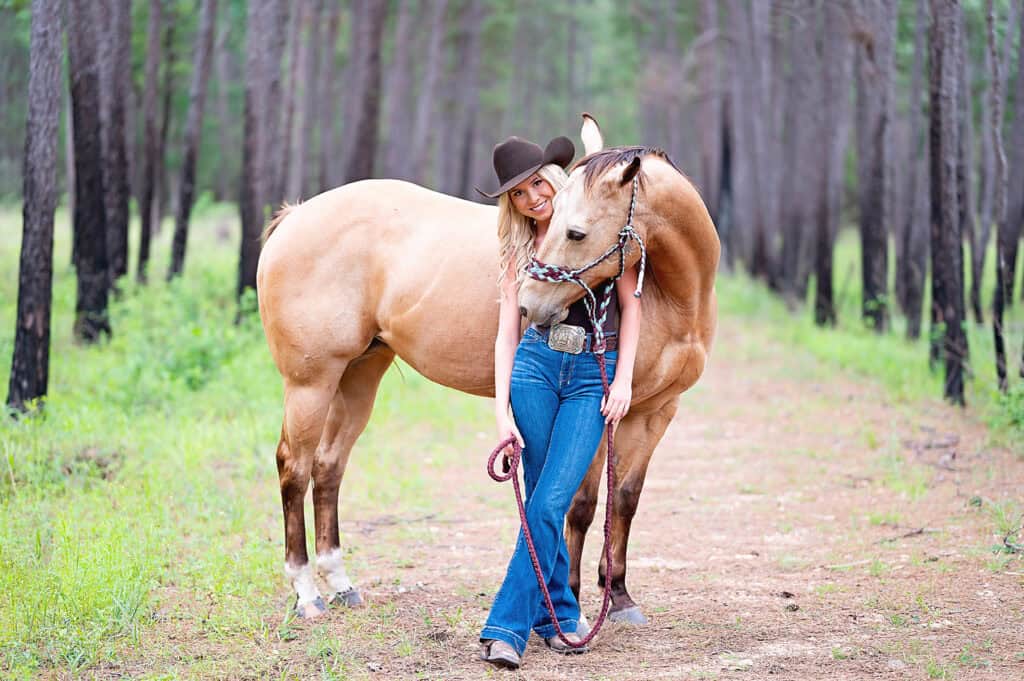 senior girl with her horse giving her a hug