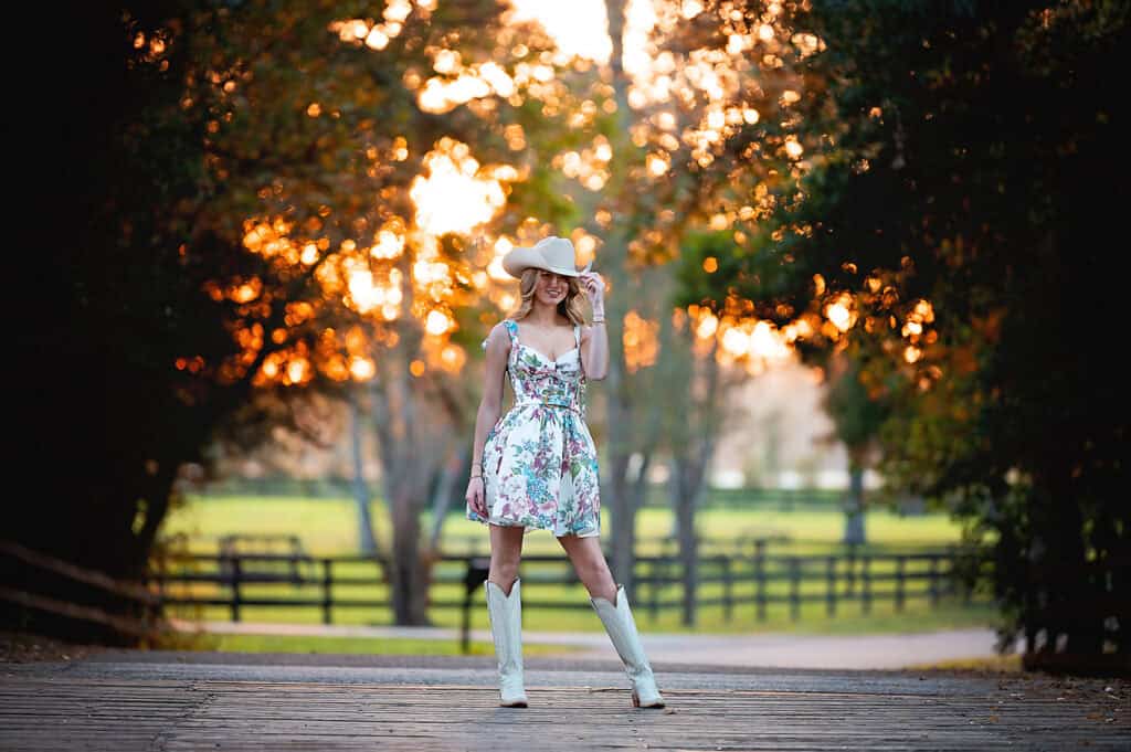 golden hour senior session for a girl with cowboy hat