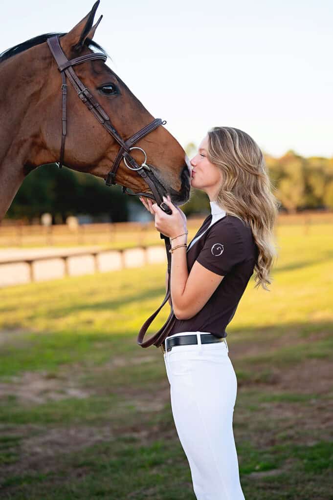 senior girl kissing horse